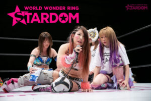 Jungle Kyona speaks with Stars behind her at Stardom Nagoya Rainbow Fight.